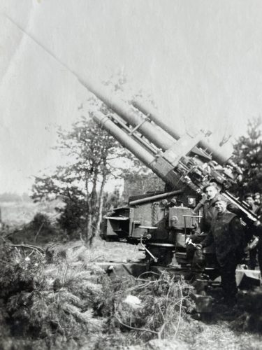 N202 - 105mm AA Gun, Germany, April 1945. Lupton in firing seat - Rfn. A.W. Lupton coll.